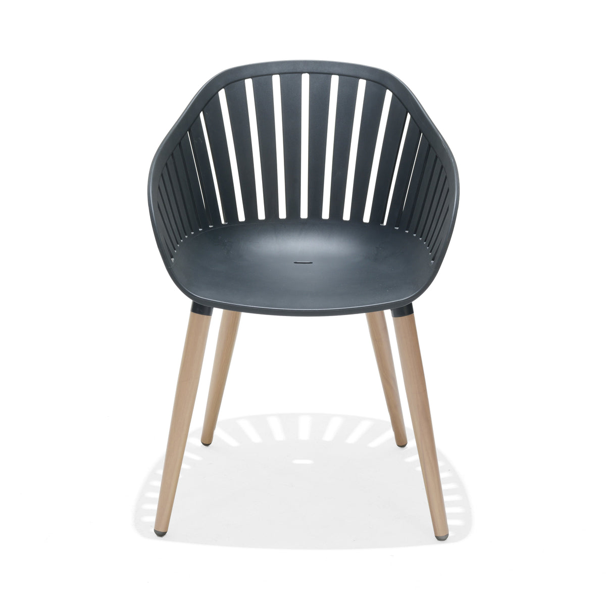 Close view of a black dining chair with FSC-certified wood legs.