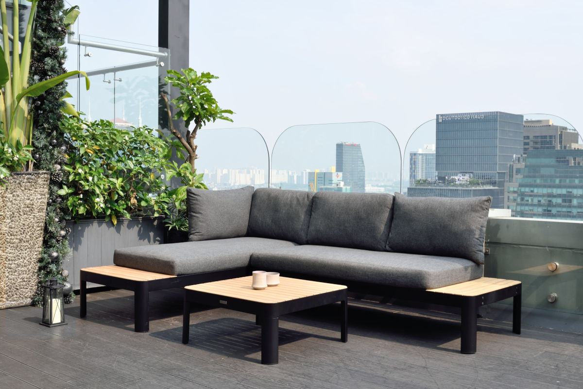 Two-seat outdoor sofa shown in a broader outdoor seating arrangement.
