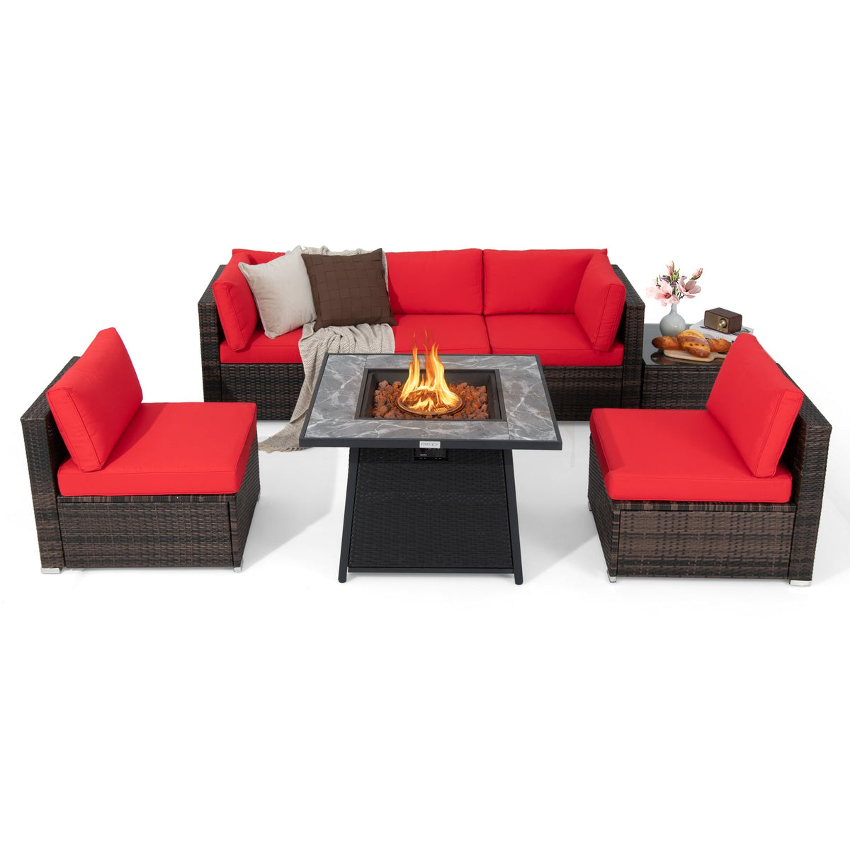 Seven-piece patio set in dark brown wicker with red cushions and a fire pit table.