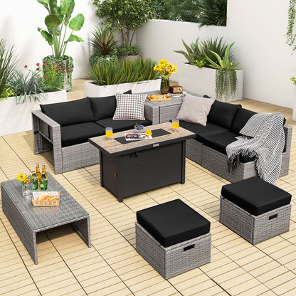 Light gray wicker patio set with black cushions arranged on a tile patio.