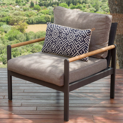 Side view of the outdoor lounge chair with aluminium frame, FSC teak armrests, and cushioned back.