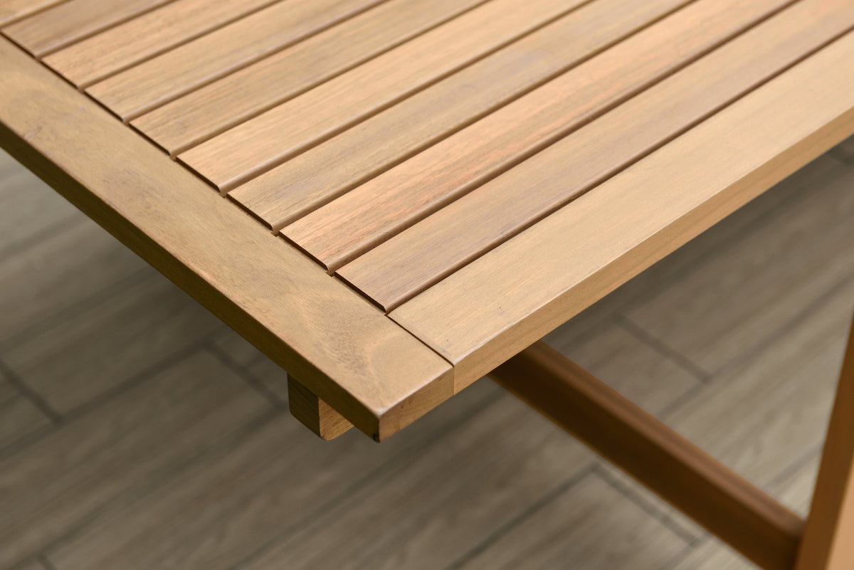Close-up of a wooden Leyland dining table.