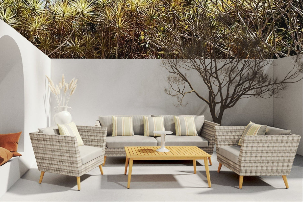 FSC eucalyptus wicker outdoor seating arranged with cushions and a coffee table in a patio setting.