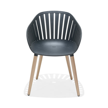 Close view of a black dining chair with FSC-certified wood legs.