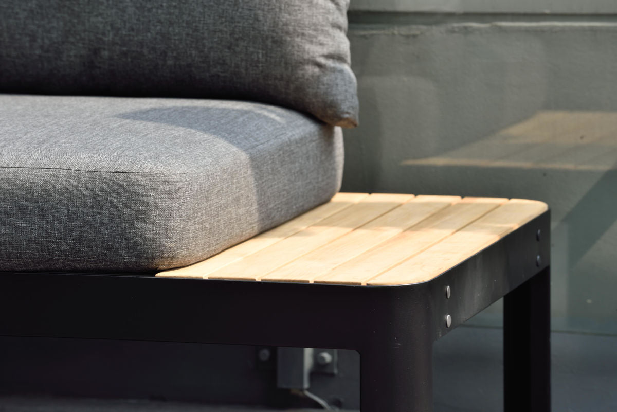 Close-up of the FSC-certified teak detail on the two-seat outdoor sofa.