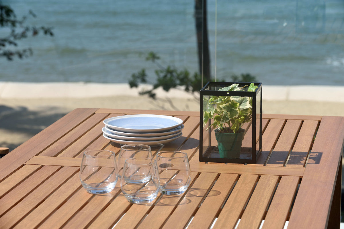 Close view of the FSC hardwood dining table surface with a 2-inch umbrella hole.
